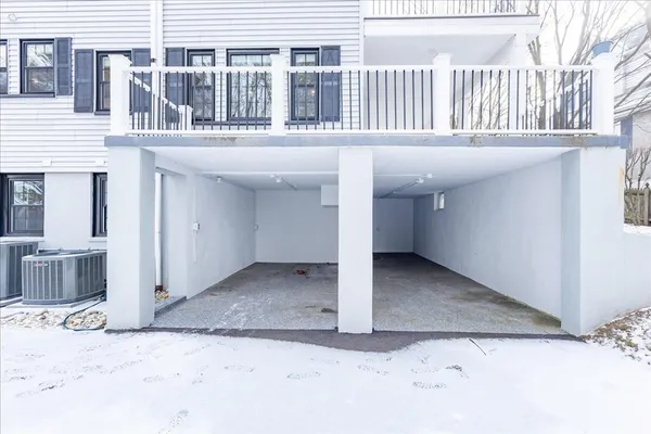 a view of a house with a snow in the background