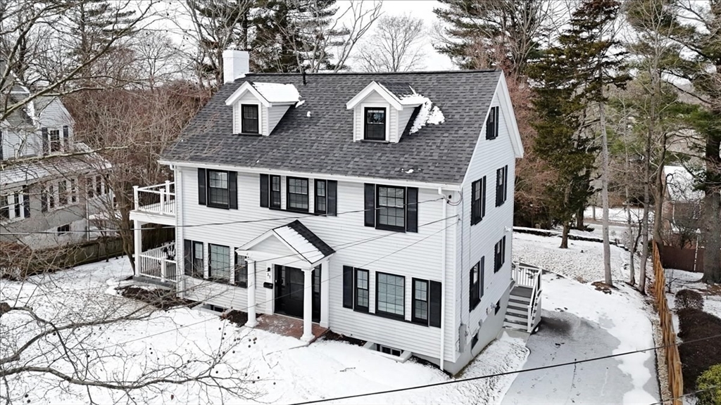 37 Wolcott Road Brookline, MA 02467 - Photo 40 of 41 a view of a white house with a large tree