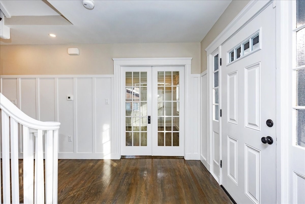 37 Wolcott Road Brookline, MA 02467 - Photo 7 of 41 a view of a hallway with wooden floor and entryway