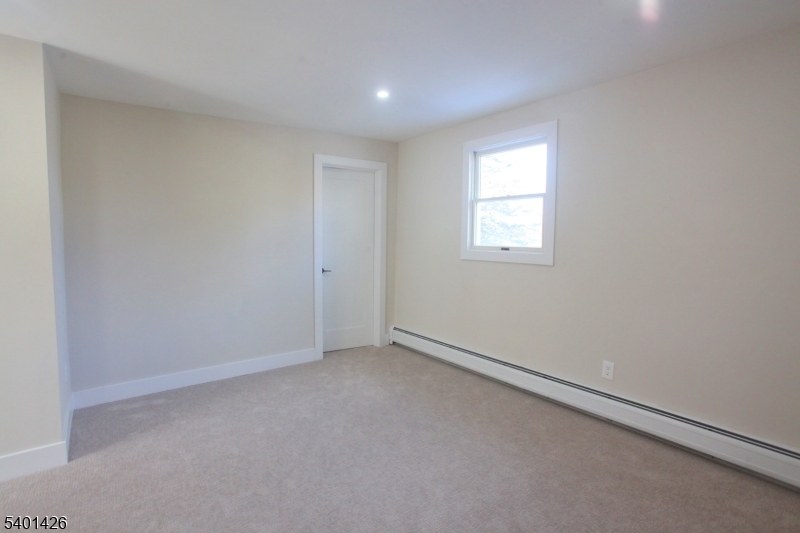 95 Forest Road Andover, NJ 07821 - Photo 13 of 29 an empty room with a window