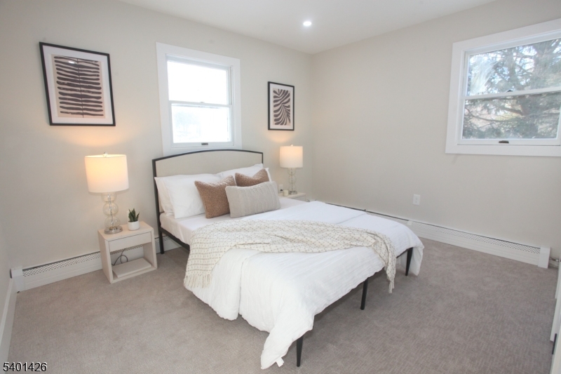 95 Forest Road Andover, NJ 07821 - Photo 8 of 29 a bed room with a bed and a lamp