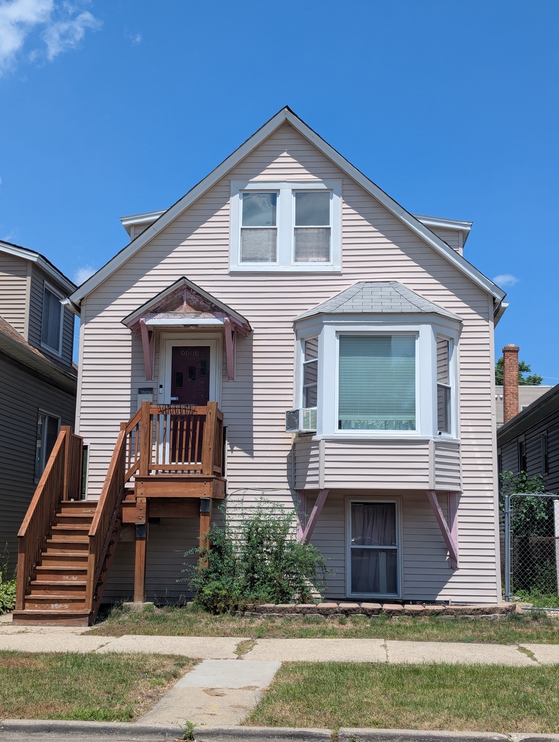 6606 West George Street, Unit 2 Chicago, IL 60634 - Photo 1 of 8 a front view of house with yard