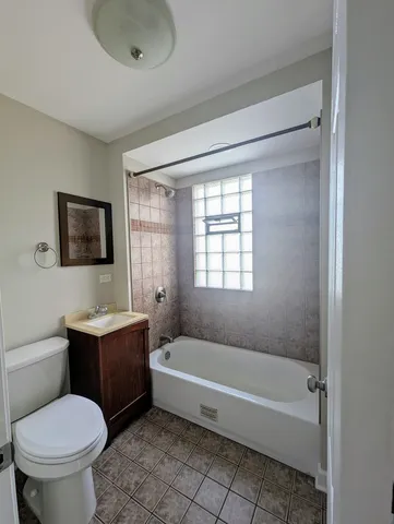 a bathroom with a sink toilet and bathtub