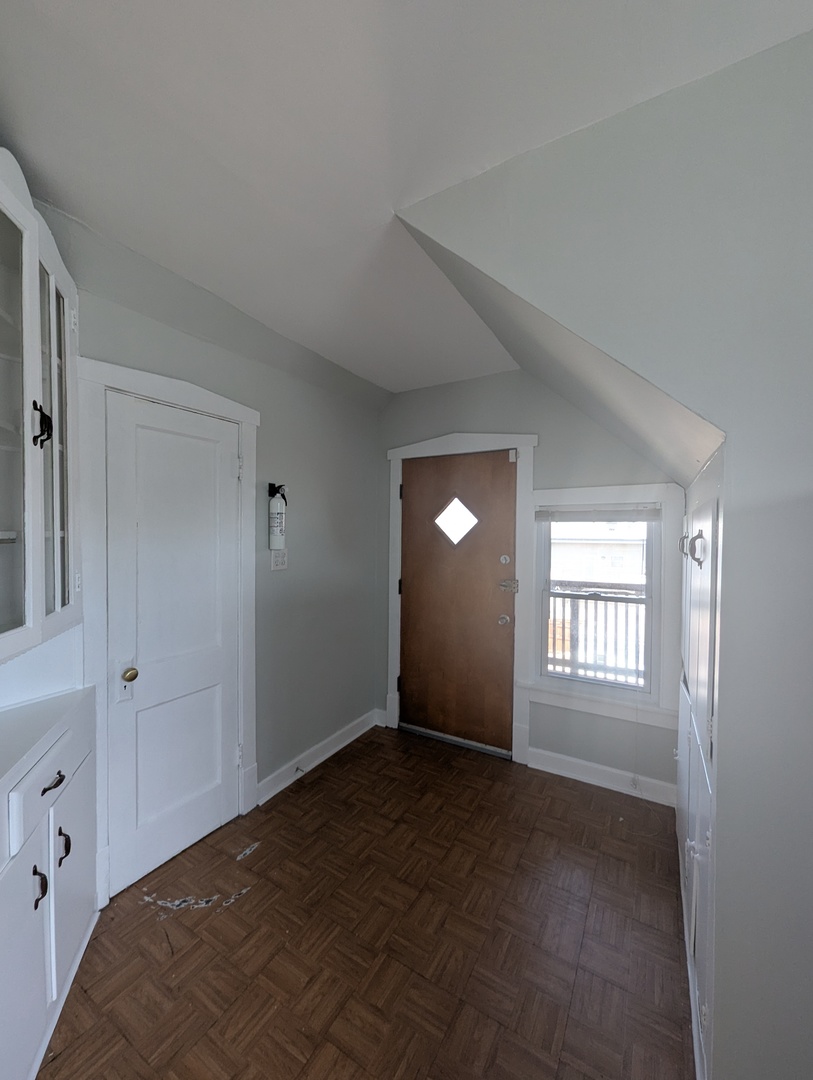 6606 West George Street, Unit 2 Chicago, IL 60634 - Photo 5 of 8 a view of empty room with window