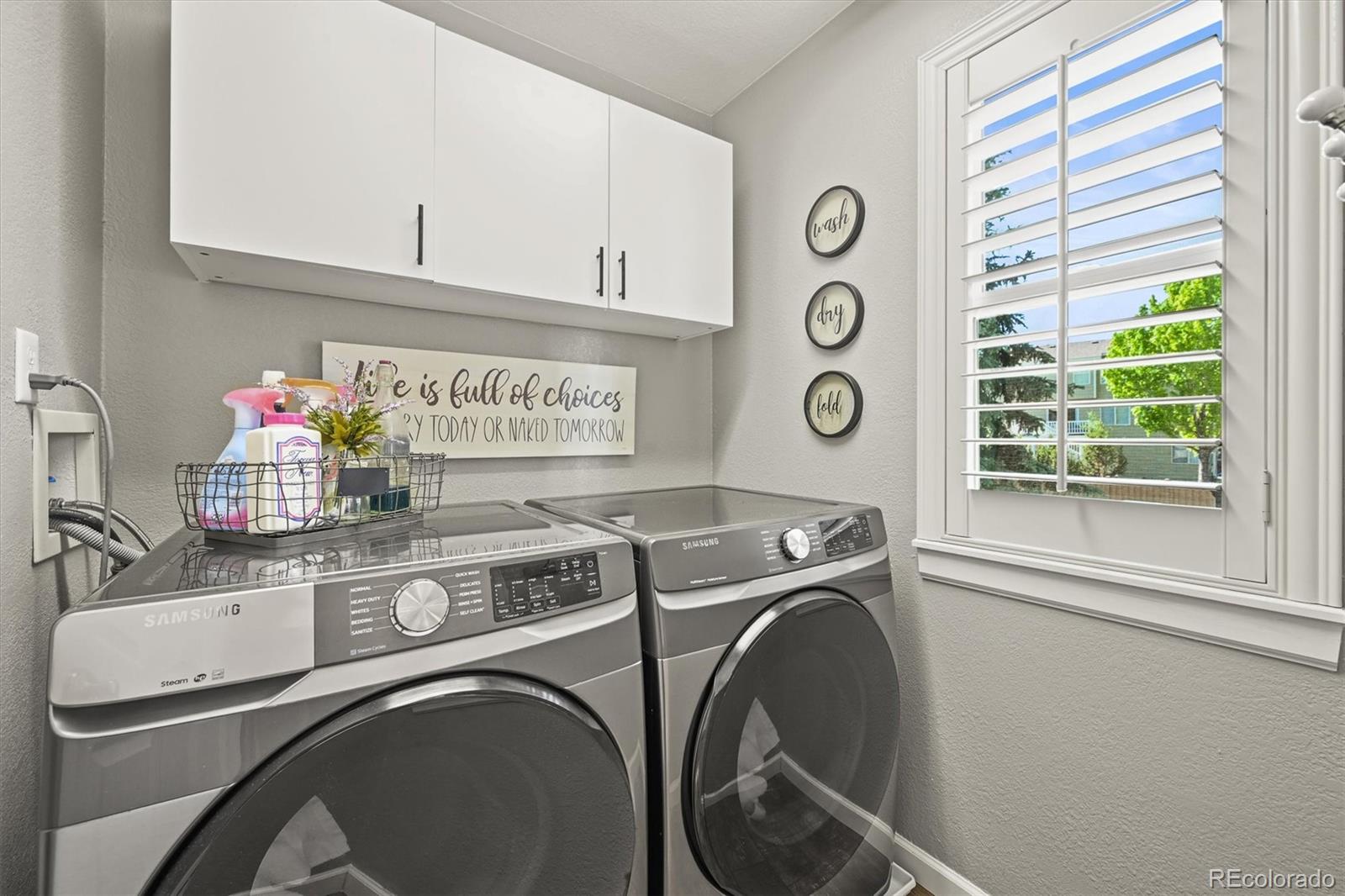 6242 Shea Place Highlands Ranch, CO 80130 - Photo 11 of 45 a utility room with dryer and washer