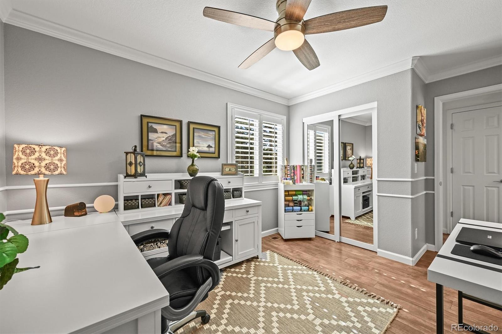 6242 Shea Place Highlands Ranch, CO 80130 - Photo 12 of 45 a view of a workspace with furniture and a window