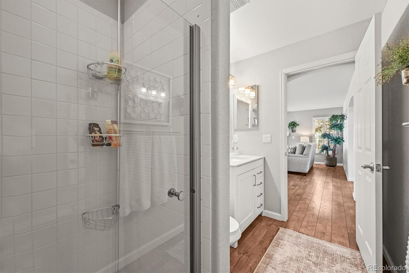 6242 Shea Place Highlands Ranch, CO 80130 - Photo 14 of 45 a bathroom with a tub shower