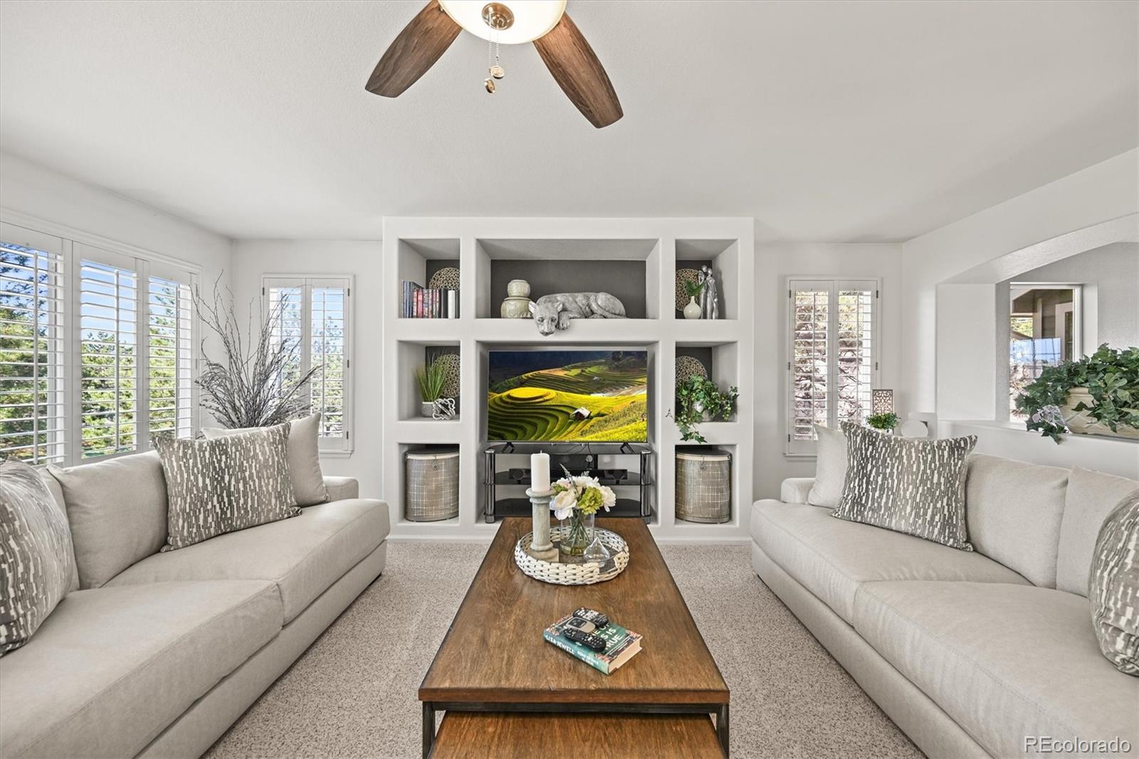 6242 Shea Place Highlands Ranch, CO 80130 - Photo 16 of 45 a living room with furniture and a large window