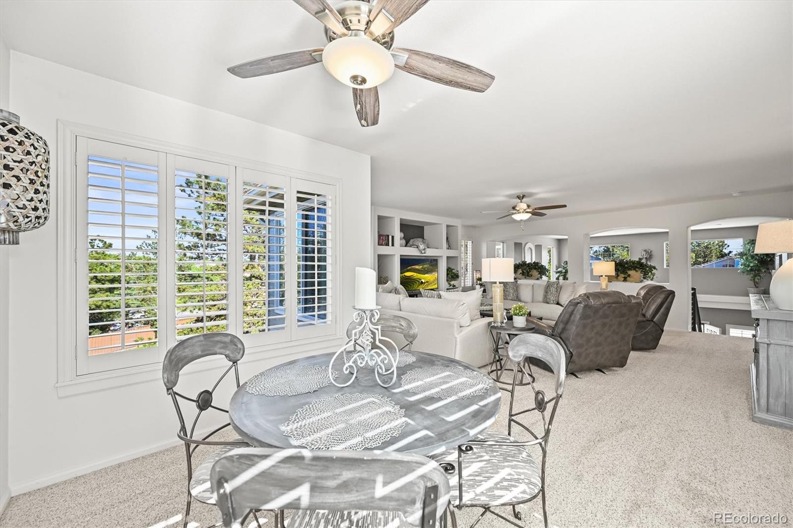 6242 Shea Place Highlands Ranch, CO 80130 - Photo 17 of 45 a living room with furniture and a large window