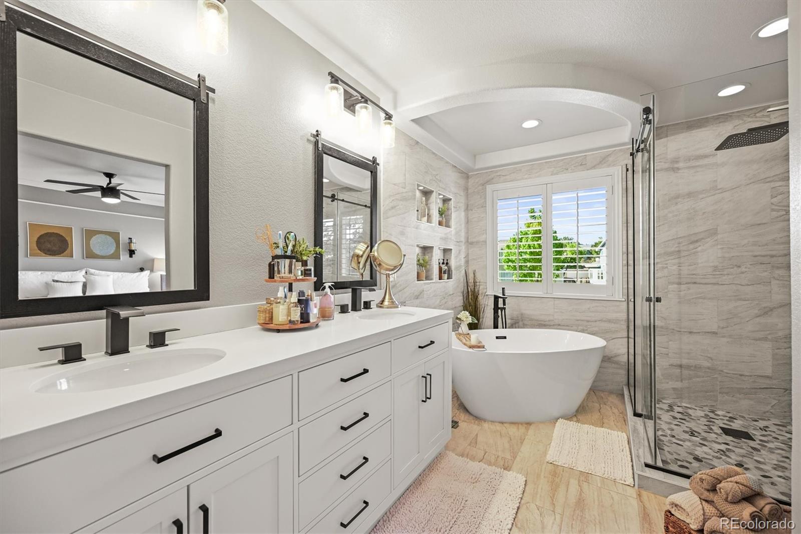 6242 Shea Place Highlands Ranch, CO 80130 - Photo 21 of 45 a bathroom with a double vanity sink mirror and bathtub