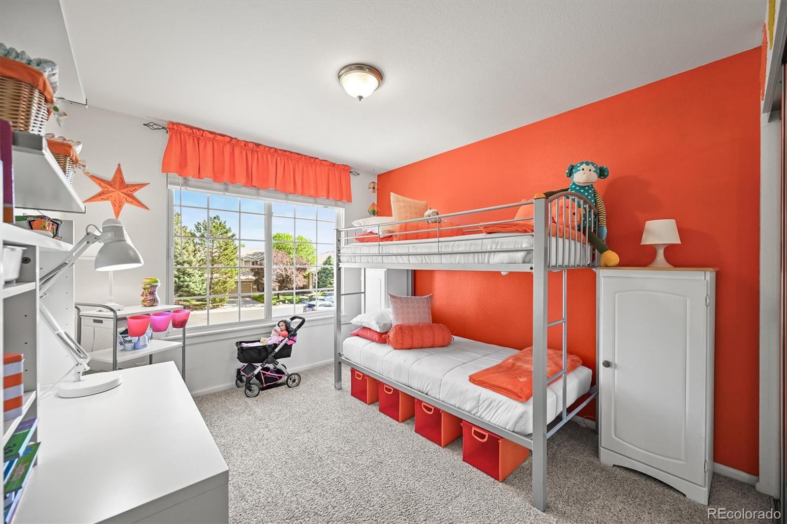 6242 Shea Place Highlands Ranch, CO 80130 - Photo 26 of 45 a bedroom with a bed and a window