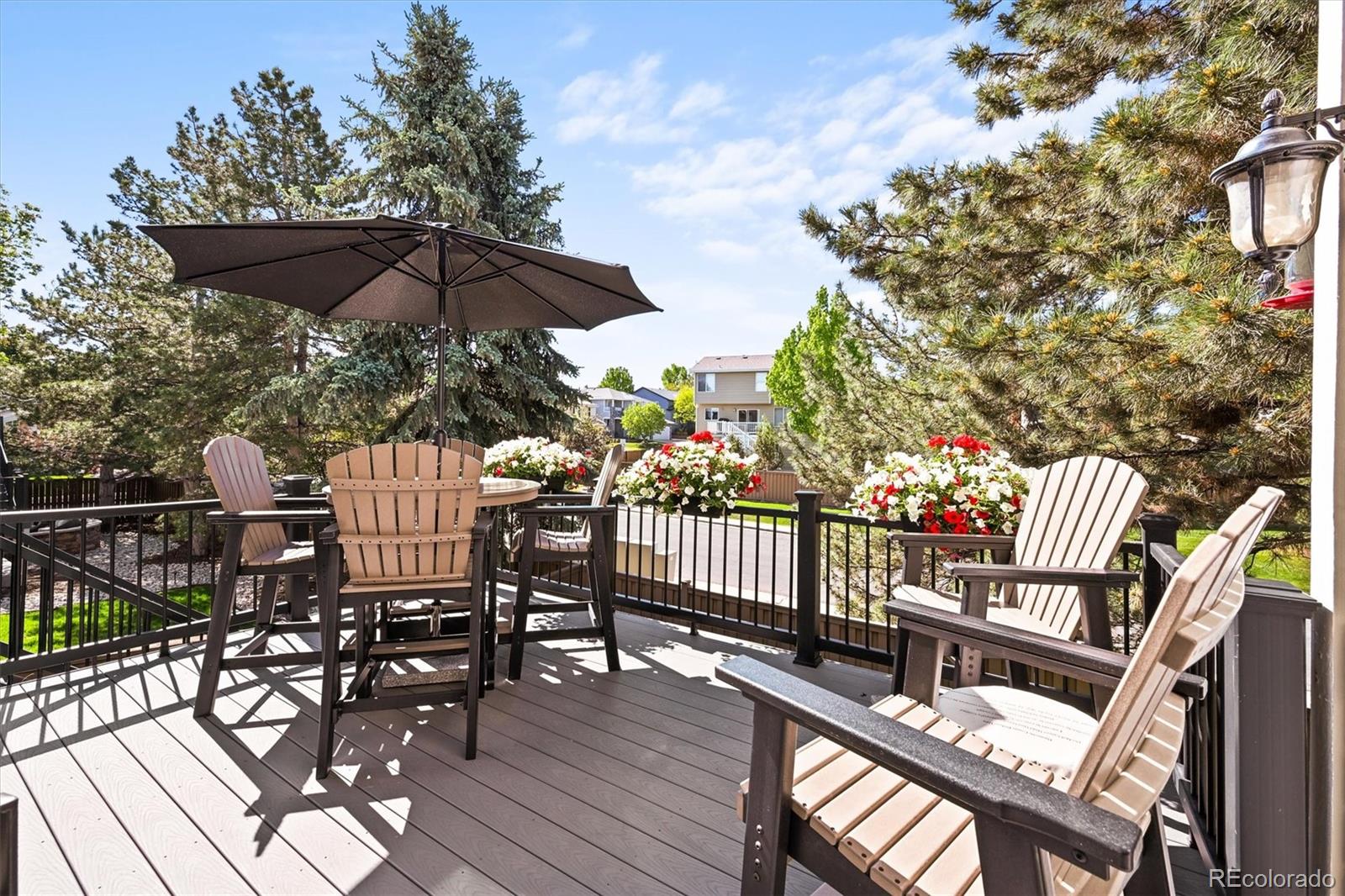 6242 Shea Place Highlands Ranch, CO 80130 - Photo 32 of 45 a view of a chair and tables in the balcony