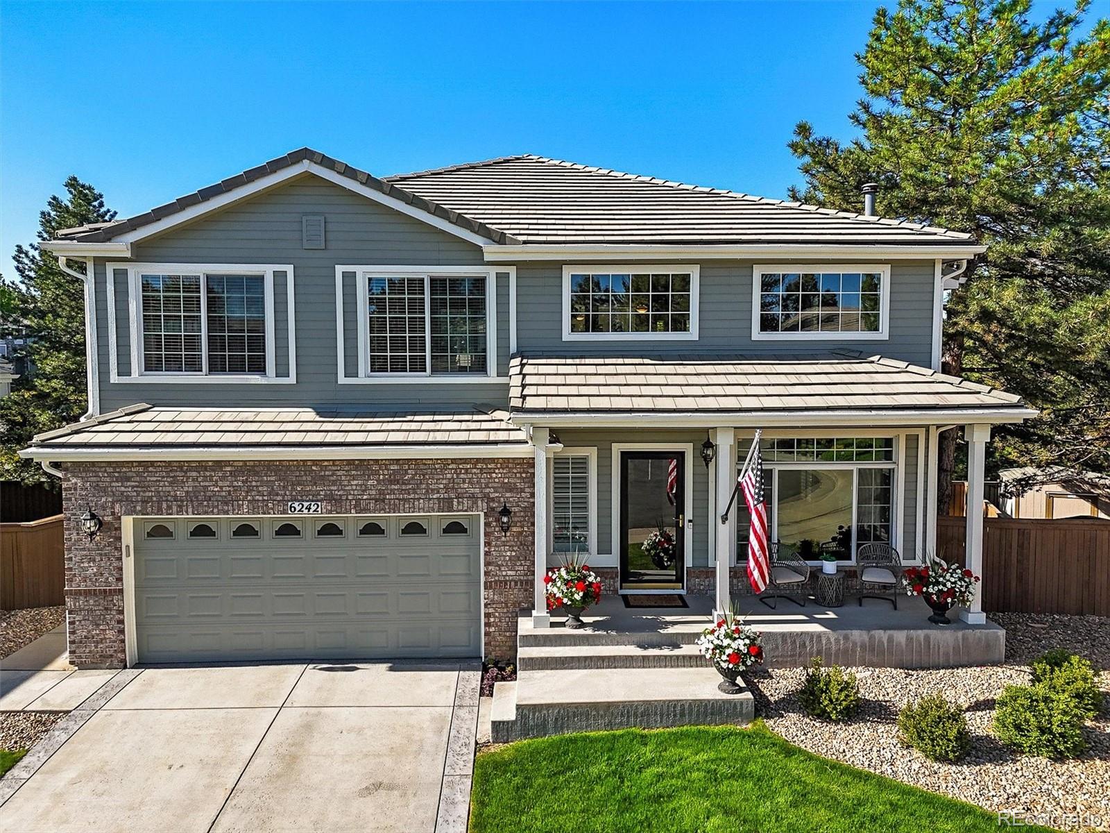 6242 Shea Place Highlands Ranch, CO 80130 - Photo 44 of 45 a view of a house with sitting area and garden