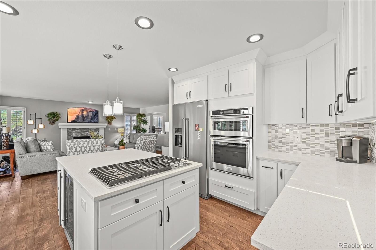 6242 Shea Place Highlands Ranch, CO 80130 - Photo 10 of 45 a kitchen with stainless steel appliances granite countertop a stove and a refrigerator