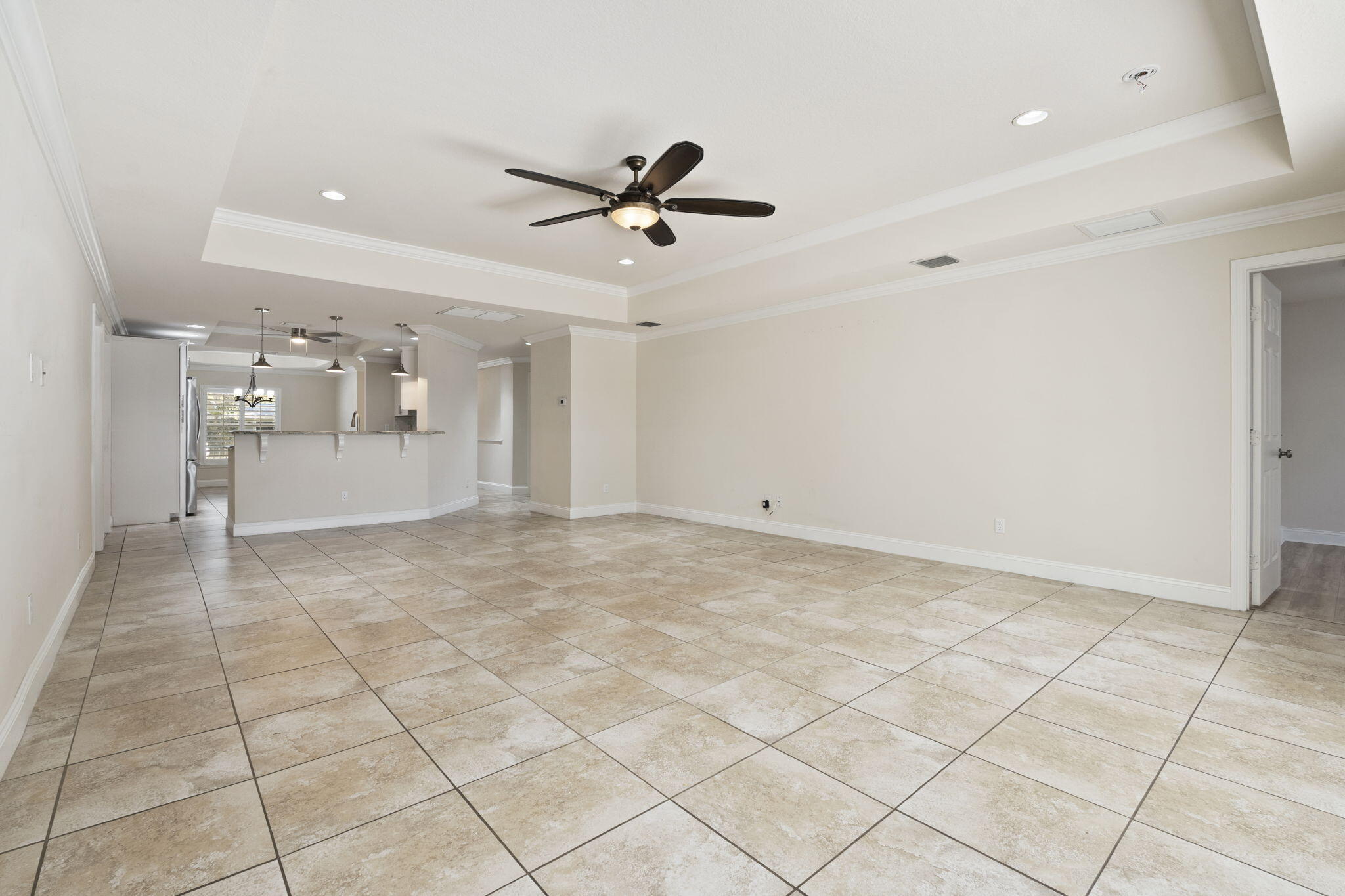339 Southwest Winnachee Drive Stuart, FL 34994 - Photo 17 of 52 a view of a livingroom with a furniture and a ceiling fan