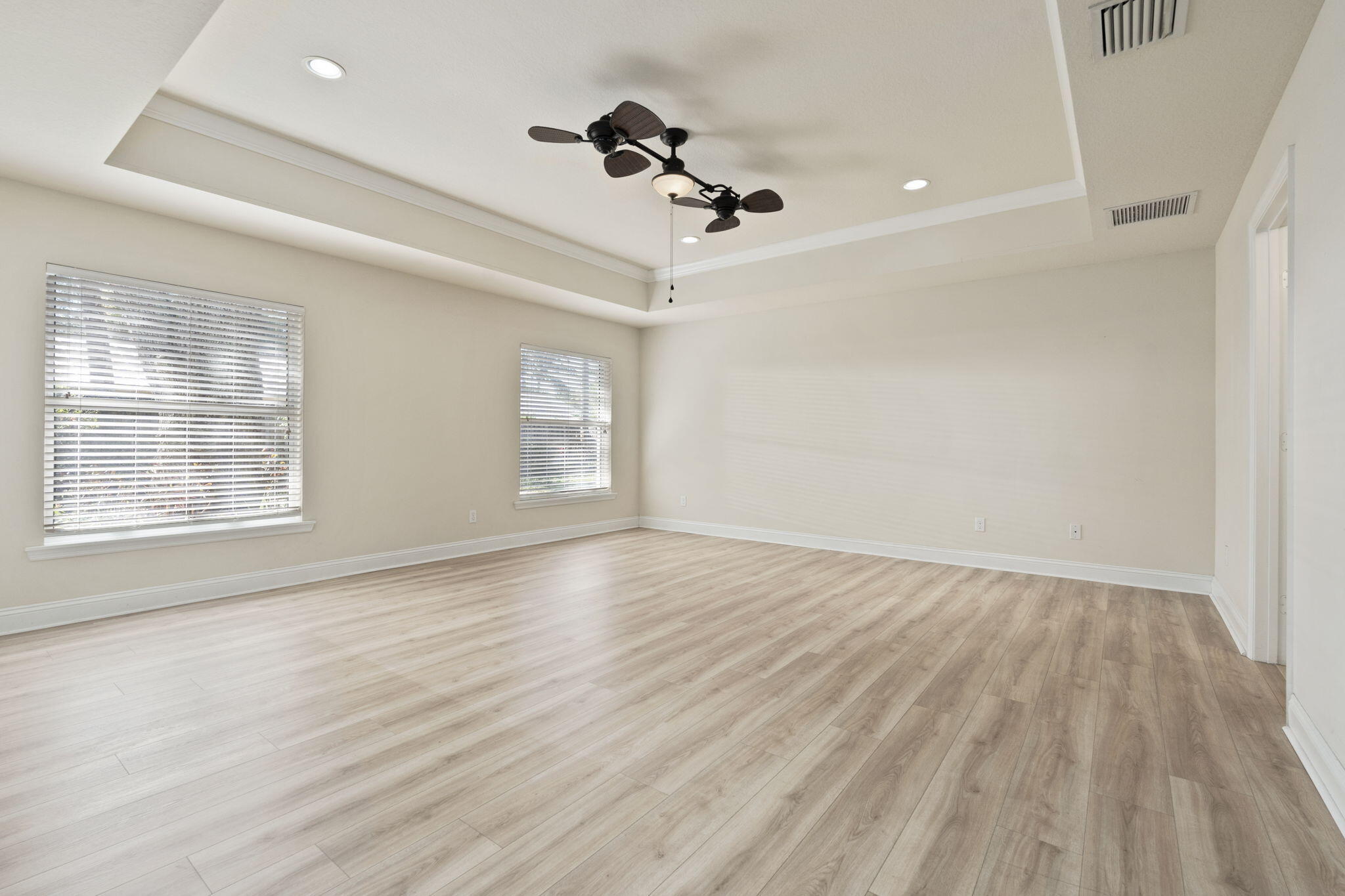 339 Southwest Winnachee Drive Stuart, FL 34994 - Photo 19 of 52 wooden floor in an empty room with a window