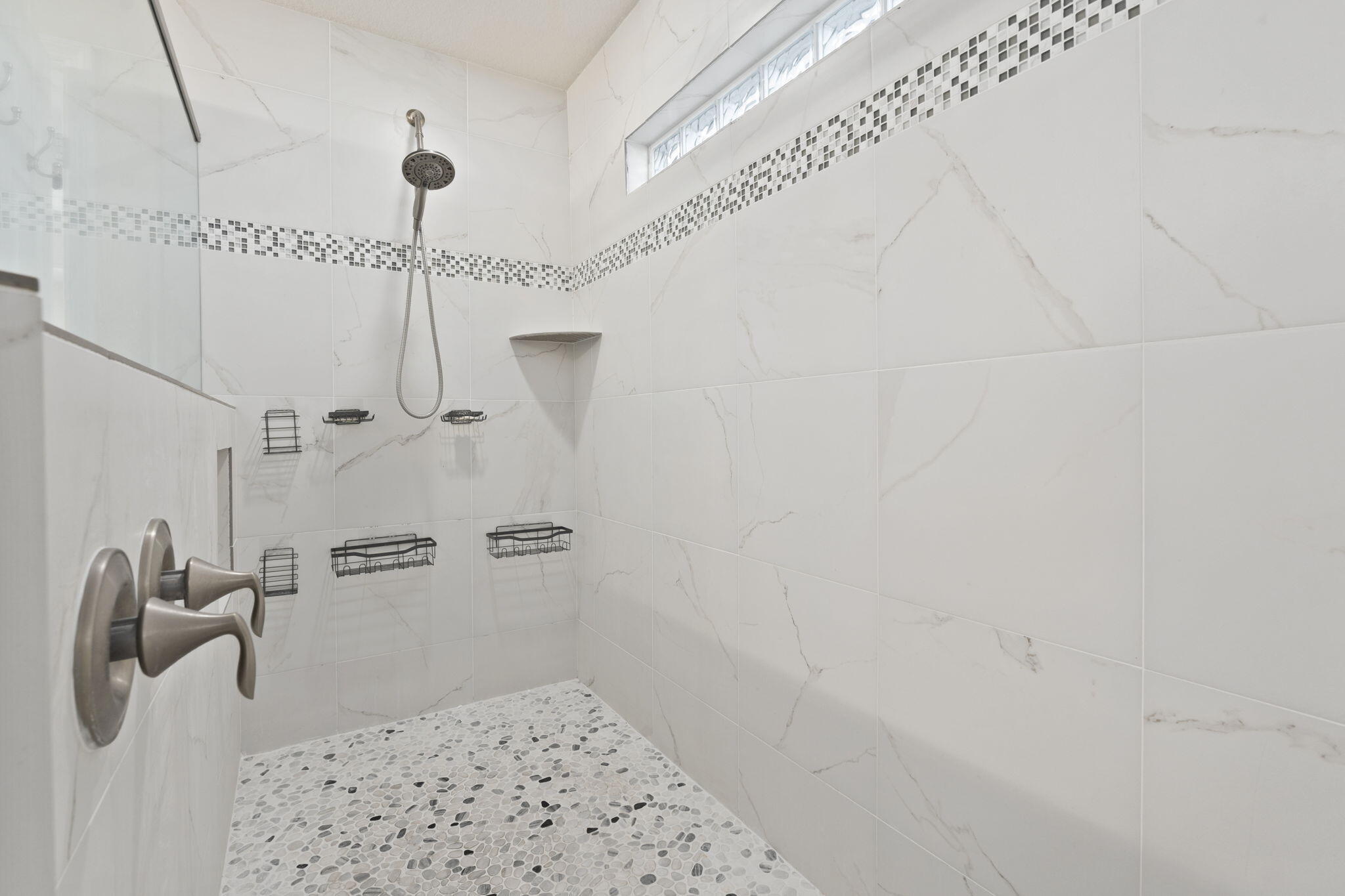339 Southwest Winnachee Drive Stuart, FL 34994 - Photo 23 of 52 a bathroom with a shower