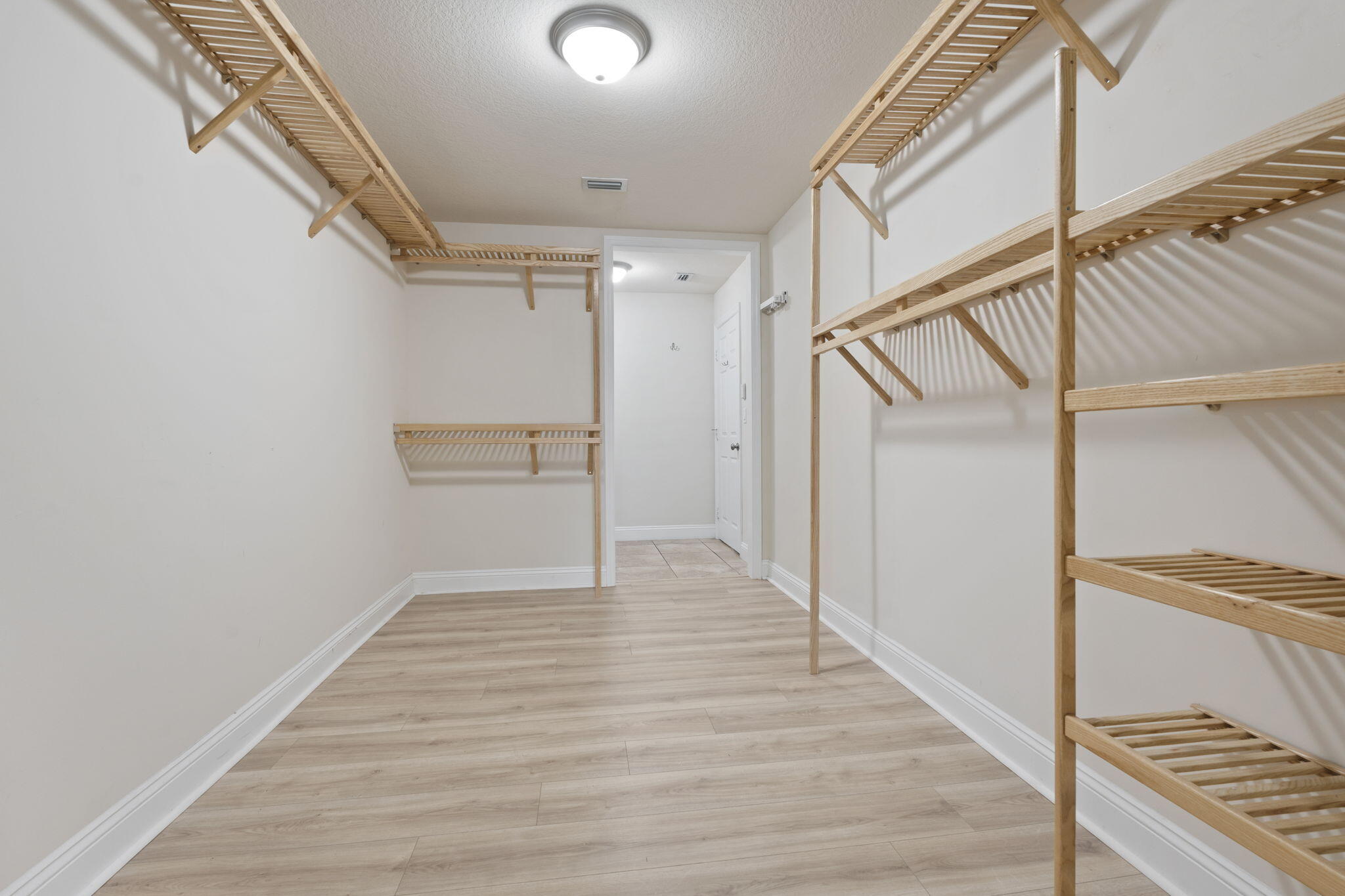 339 Southwest Winnachee Drive Stuart, FL 34994 - Photo 25 of 52 a view of an empty walk in closet