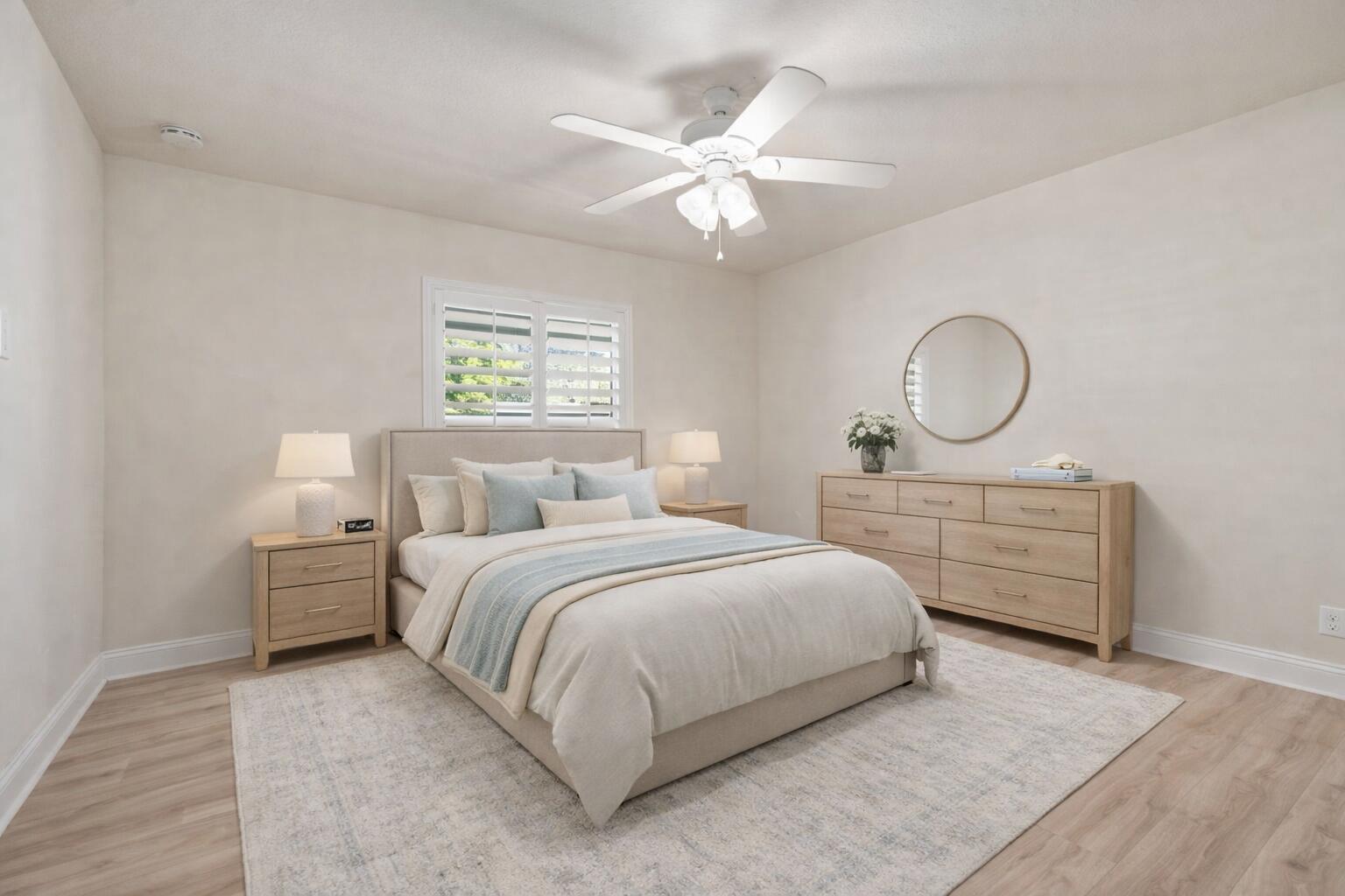 339 Southwest Winnachee Drive Stuart, FL 34994 - Photo 27 of 52 a bedroom with bed and a chandelier