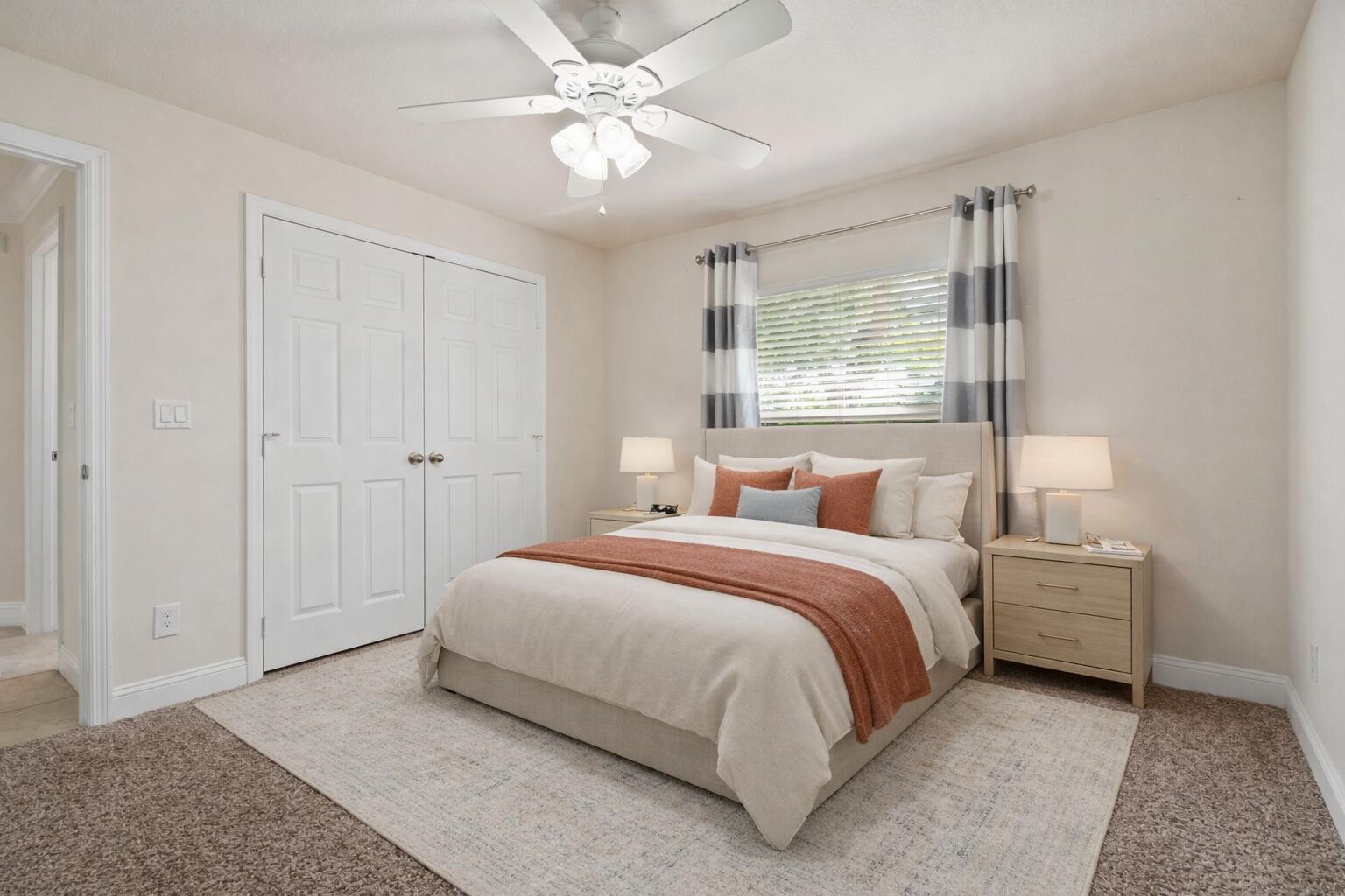 339 Southwest Winnachee Drive Stuart, FL 34994 - Photo 28 of 52 a spacious bedroom with a bed and a chandelier