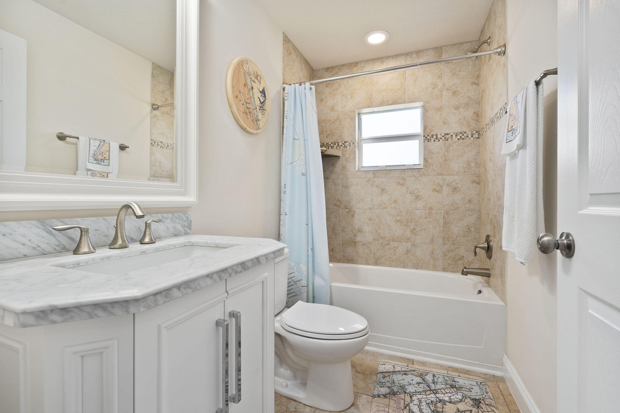 339 Southwest Winnachee Drive Stuart, FL 34994 - Photo 30 of 52 a bathroom with a granite countertop sink toilet and shower