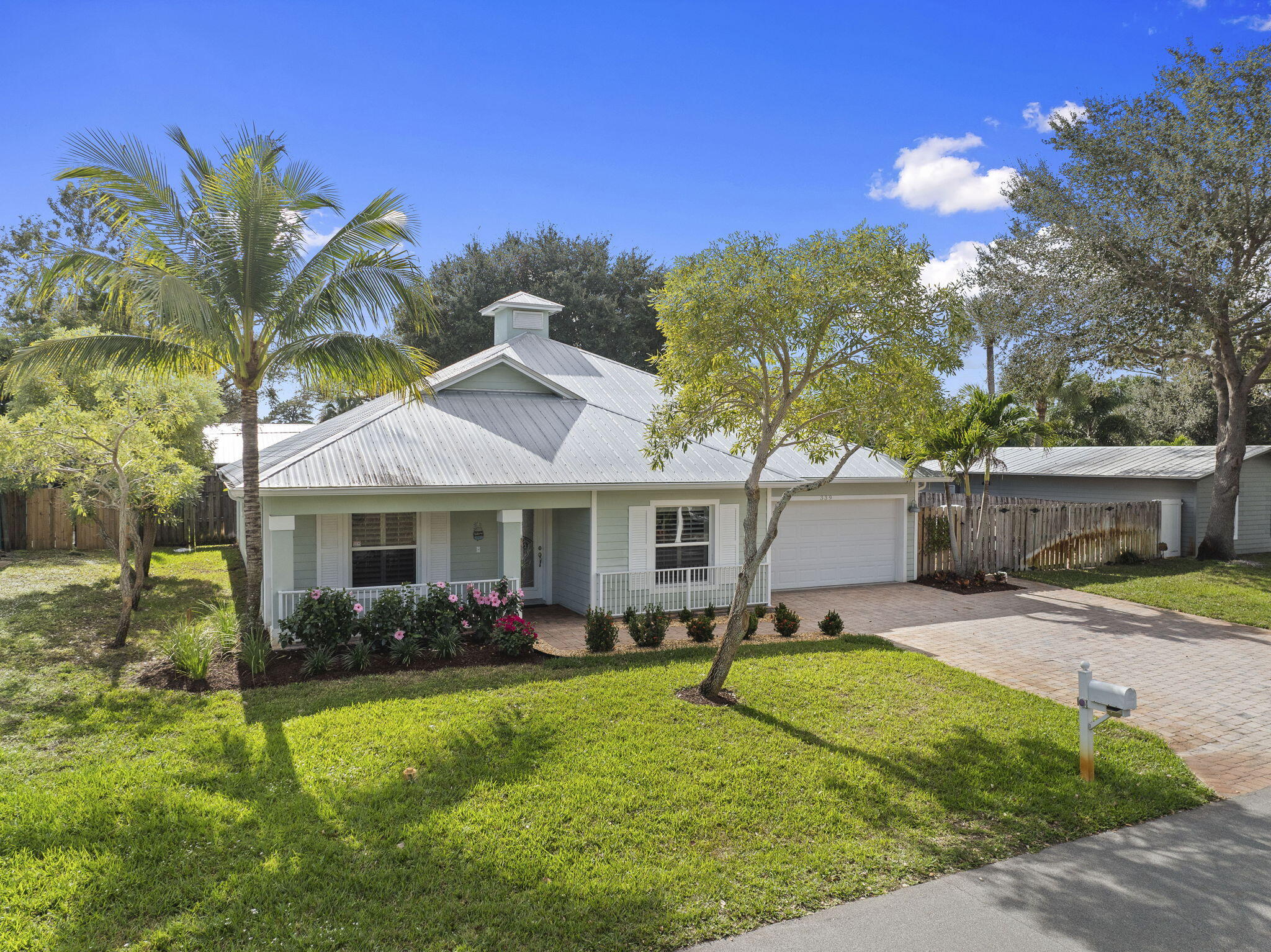 339 Southwest Winnachee Drive Stuart, FL 34994 - Photo 3 of 52 a view of a house with pool and chairs