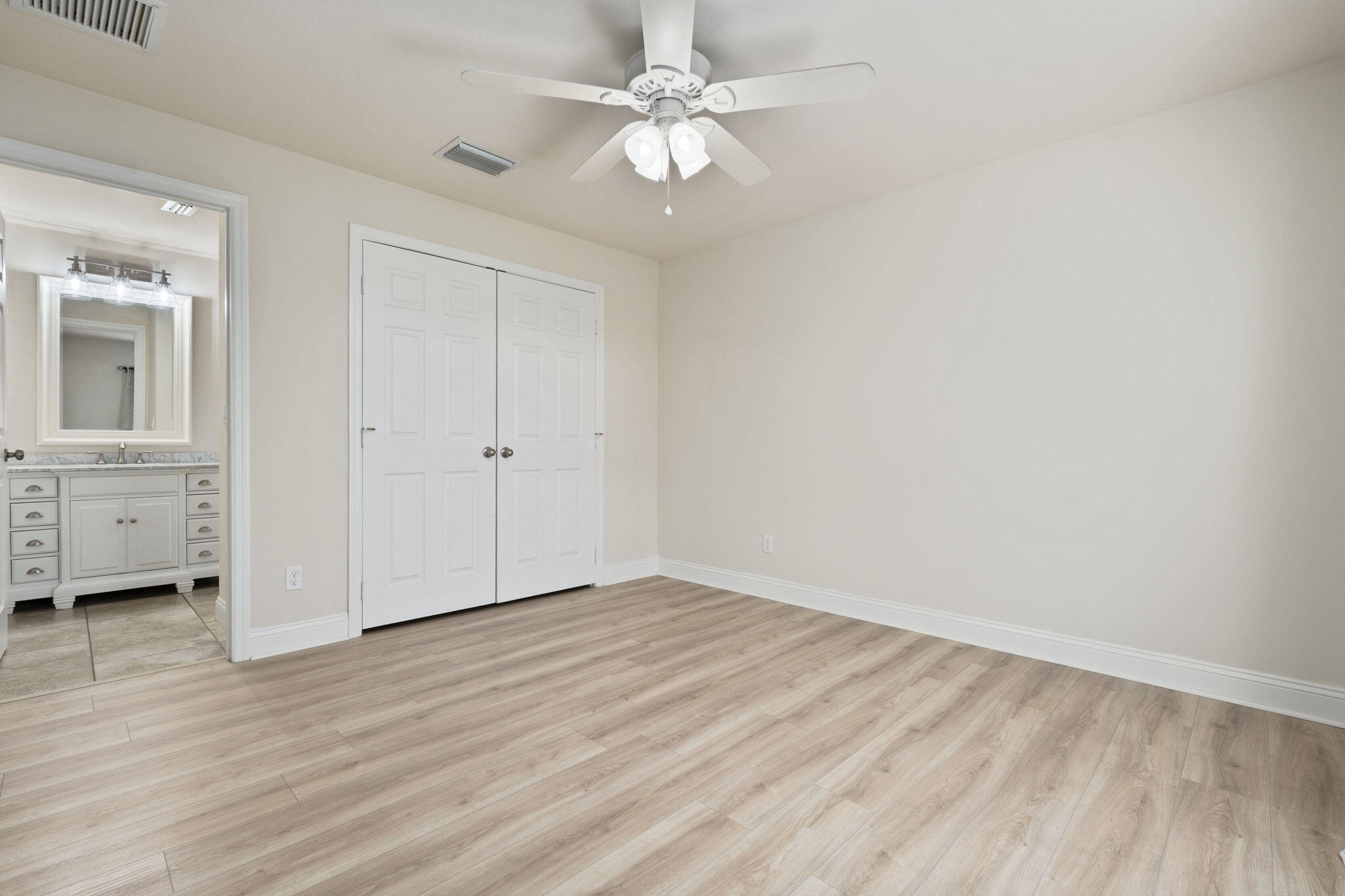 339 Southwest Winnachee Drive Stuart, FL 34994 - Photo 33 of 52 wooden floor in an empty room with a window