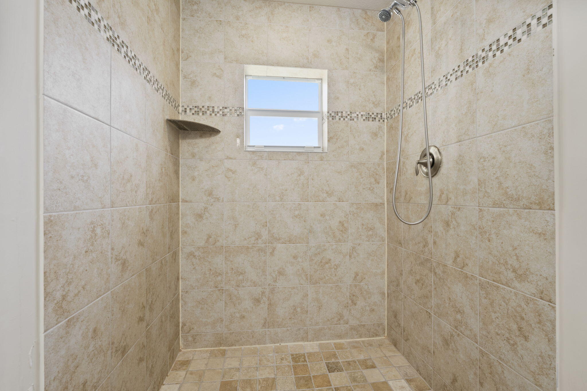339 Southwest Winnachee Drive Stuart, FL 34994 - Photo 35 of 52 a bathroom with a shower
