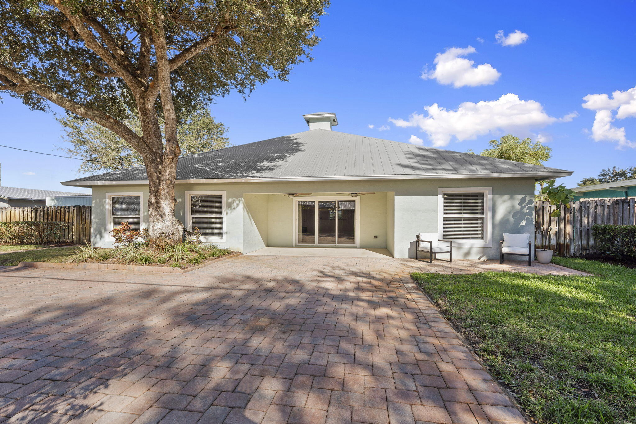 339 Southwest Winnachee Drive Stuart, FL 34994 - Photo 39 of 52 a front view of a house with yard porch and livingroom