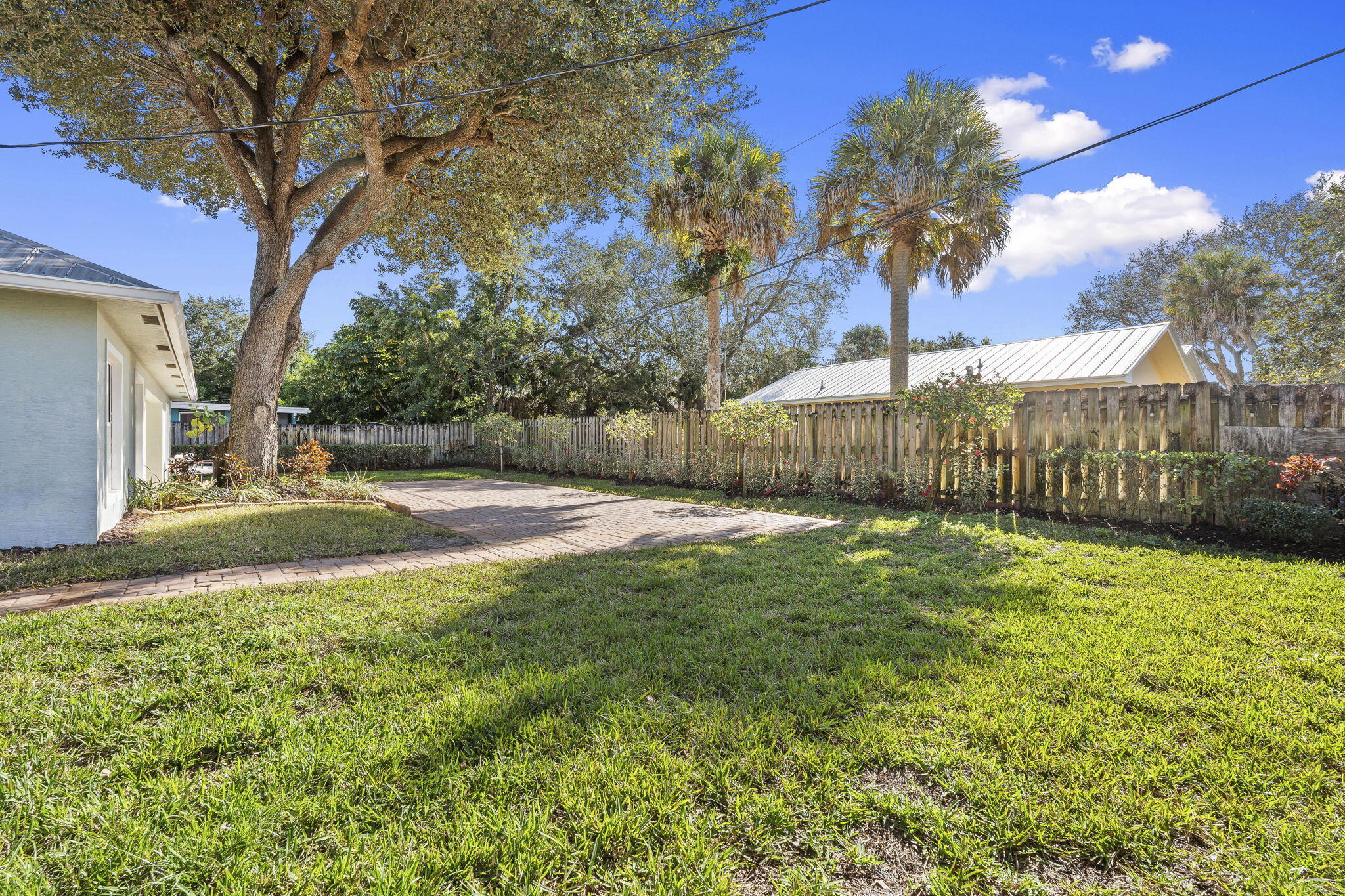 339 Southwest Winnachee Drive Stuart, FL 34994 - Photo 40 of 52 a view of backyard with tree