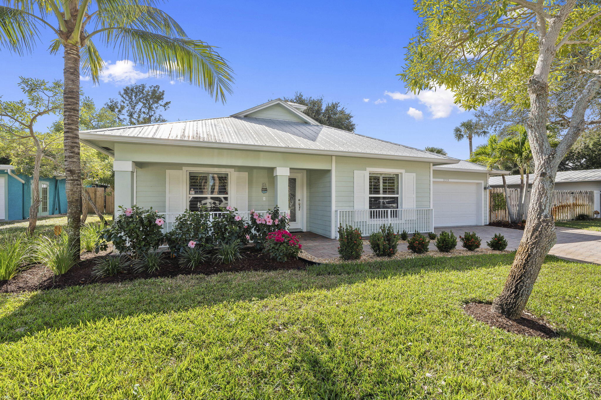 339 Southwest Winnachee Drive Stuart, FL 34994 - Photo 4 of 52 a front view of house with yard and green space
