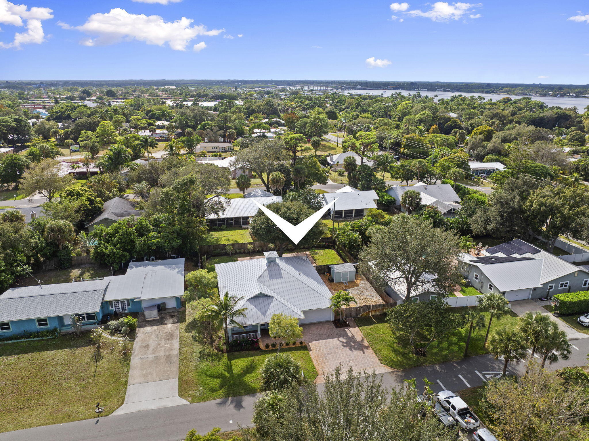 339 Southwest Winnachee Drive Stuart, FL 34994 - Photo 45 of 52 an aerial view of residential houses with outdoor space and trees