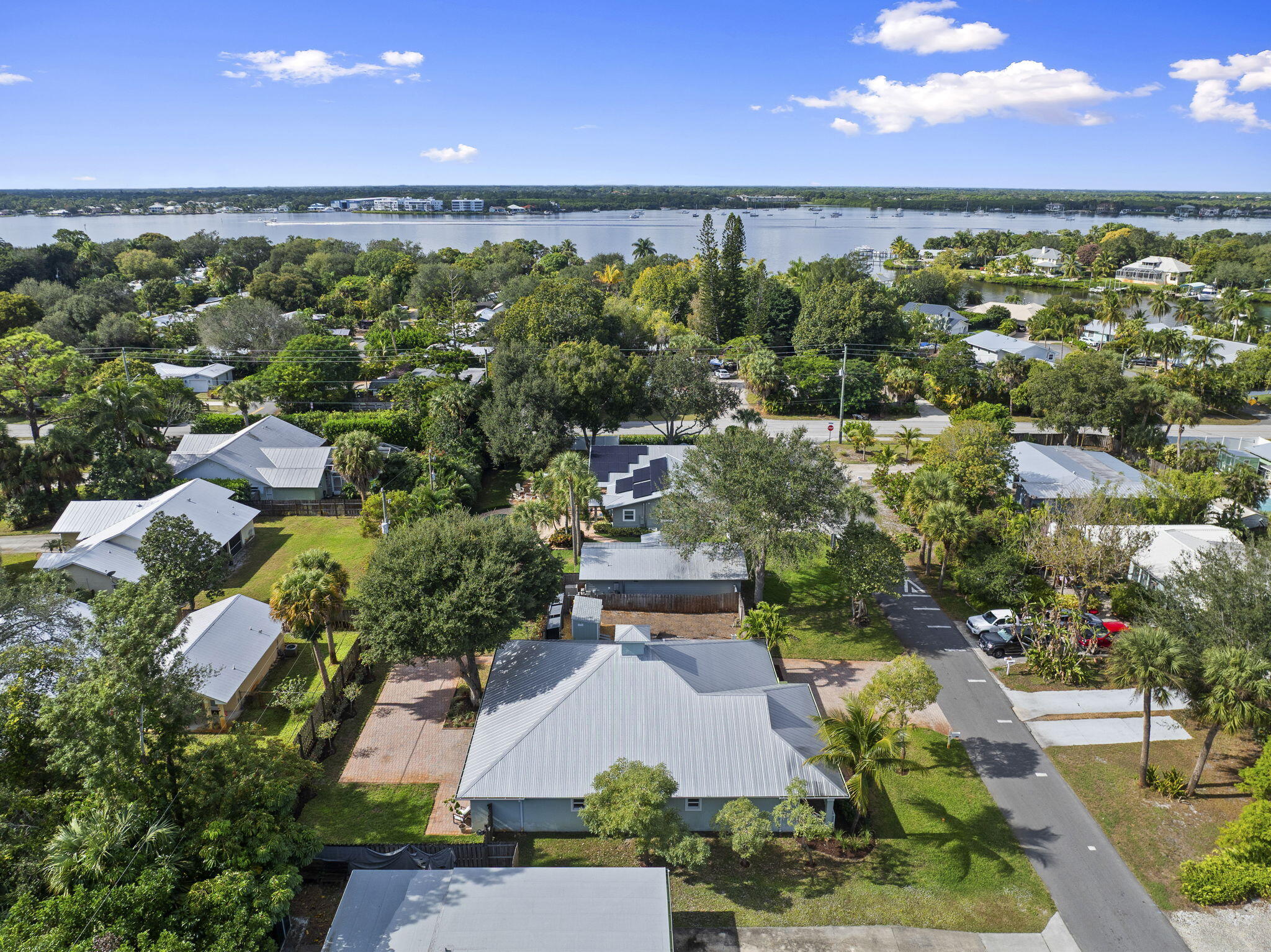 339 Southwest Winnachee Drive Stuart, FL 34994 - Photo 46 of 52 an aerial view of a house with a yard lake and outdoor space