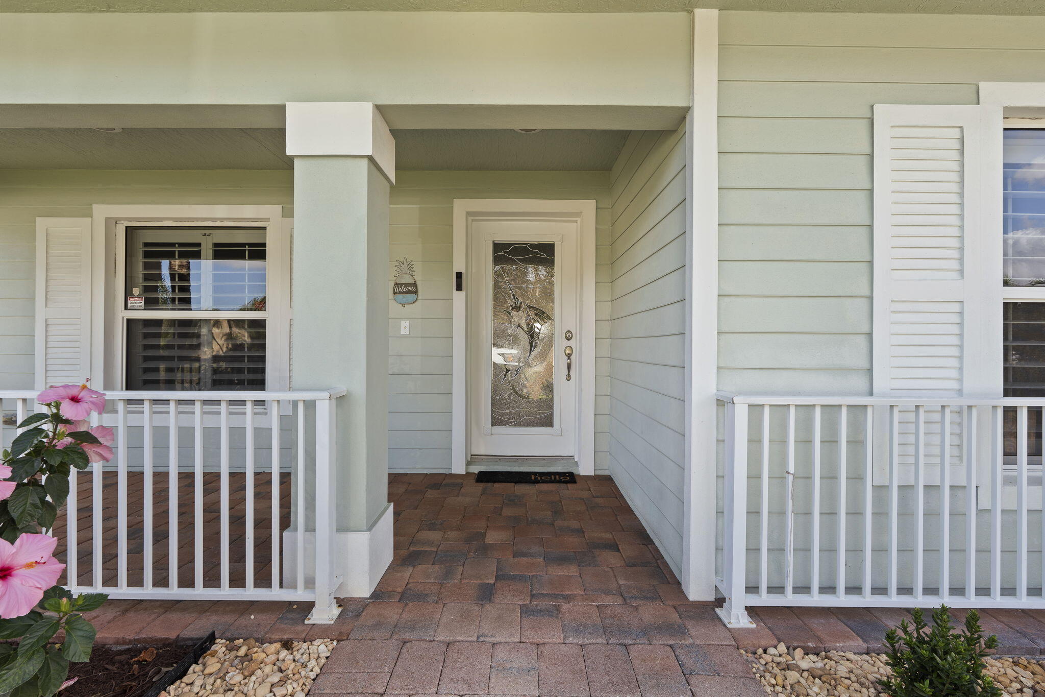 339 Southwest Winnachee Drive Stuart, FL 34994 - Photo 5 of 52 a view of a porch with a chair