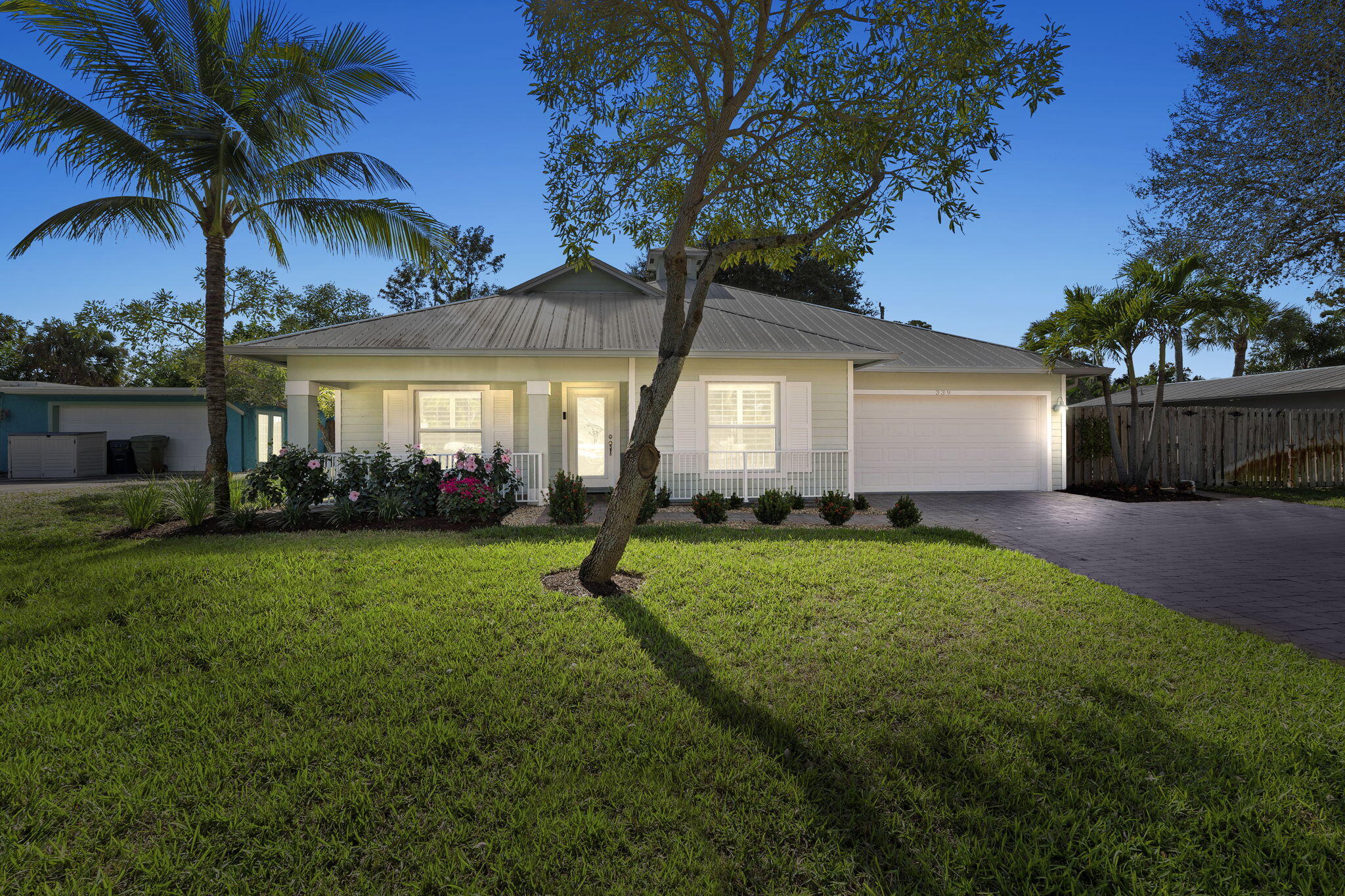 339 Southwest Winnachee Drive Stuart, FL 34994 - Photo 51 of 52 a front view of house with yard and green space