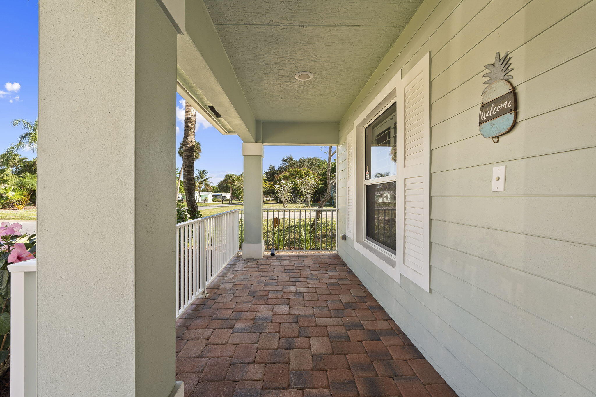 339 Southwest Winnachee Drive Stuart, FL 34994 - Photo 7 of 52 a view of a pathway along a building