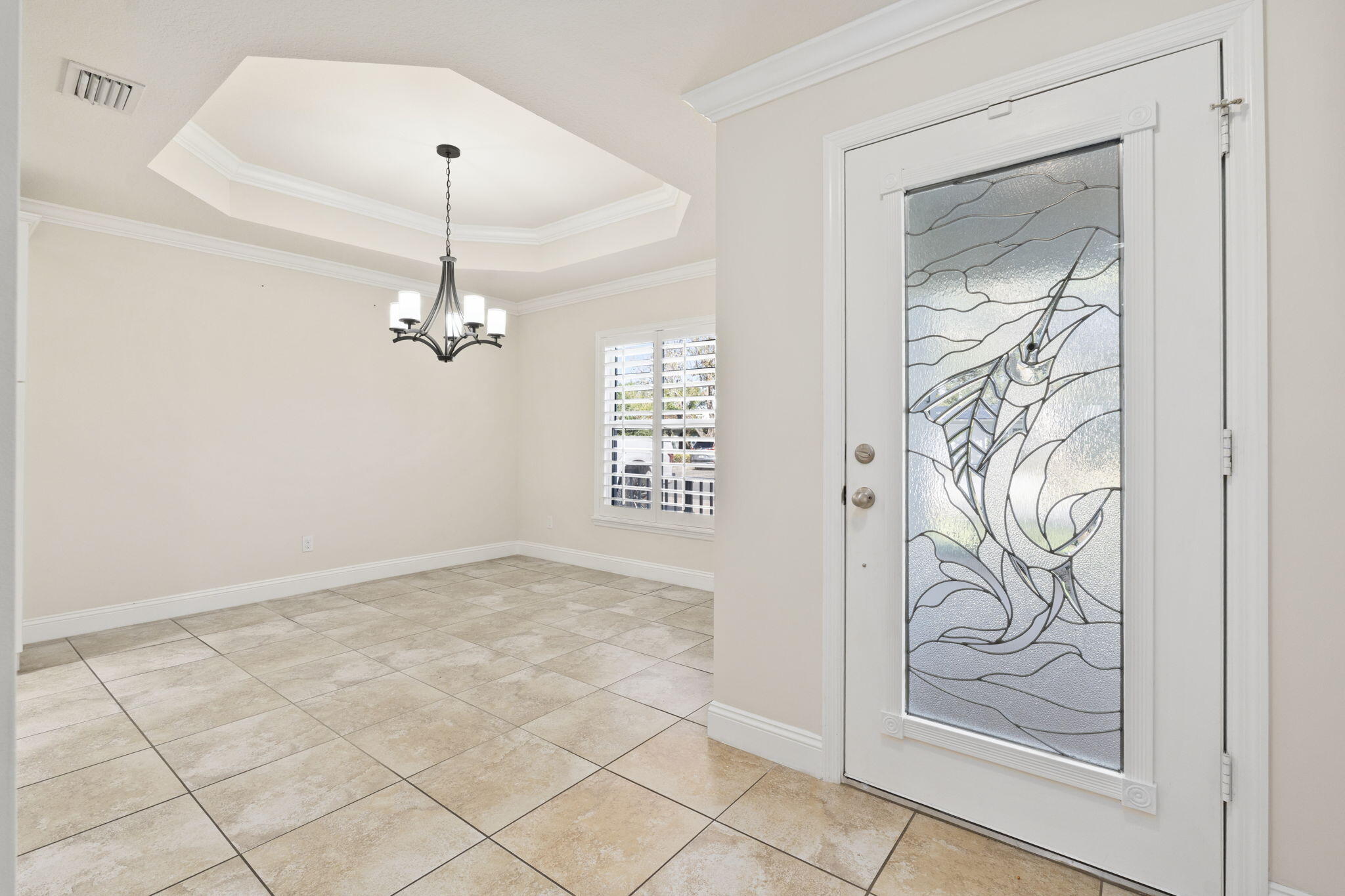 339 Southwest Winnachee Drive Stuart, FL 34994 - Photo 8 of 52 a view of a chandelier in a room
