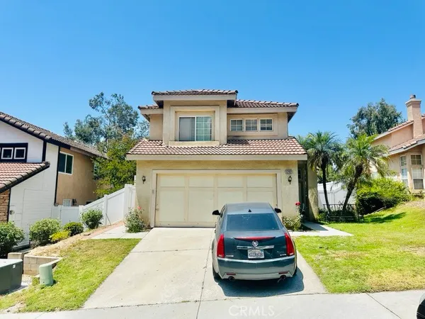 a car parked in front of a house