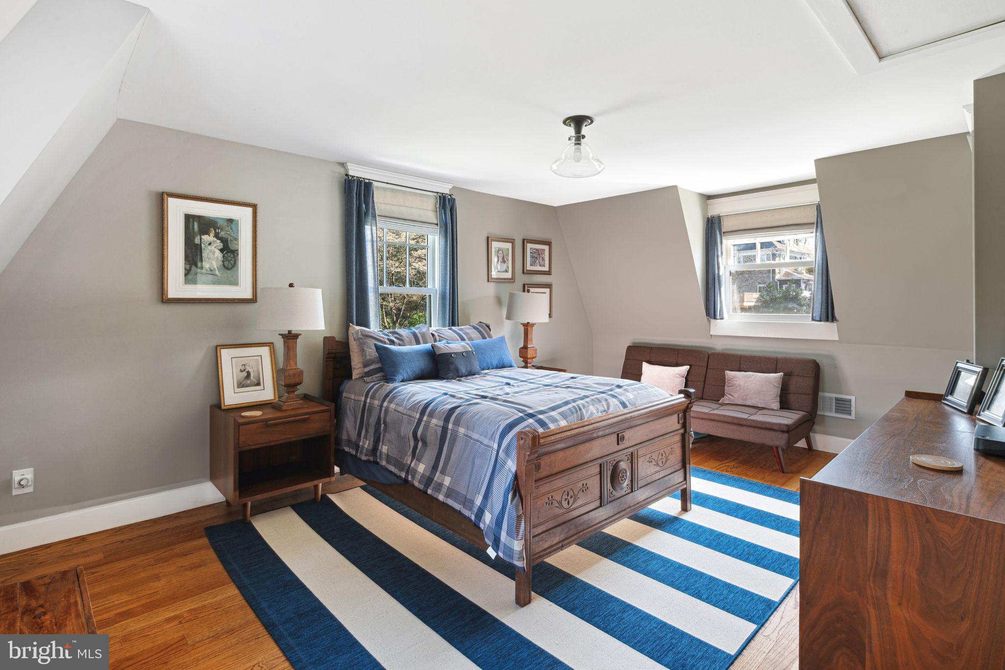 439 Crescent Road Wyncote, PA 19095 - Photo 21 of 31 a bedroom with a bed and wooden floor