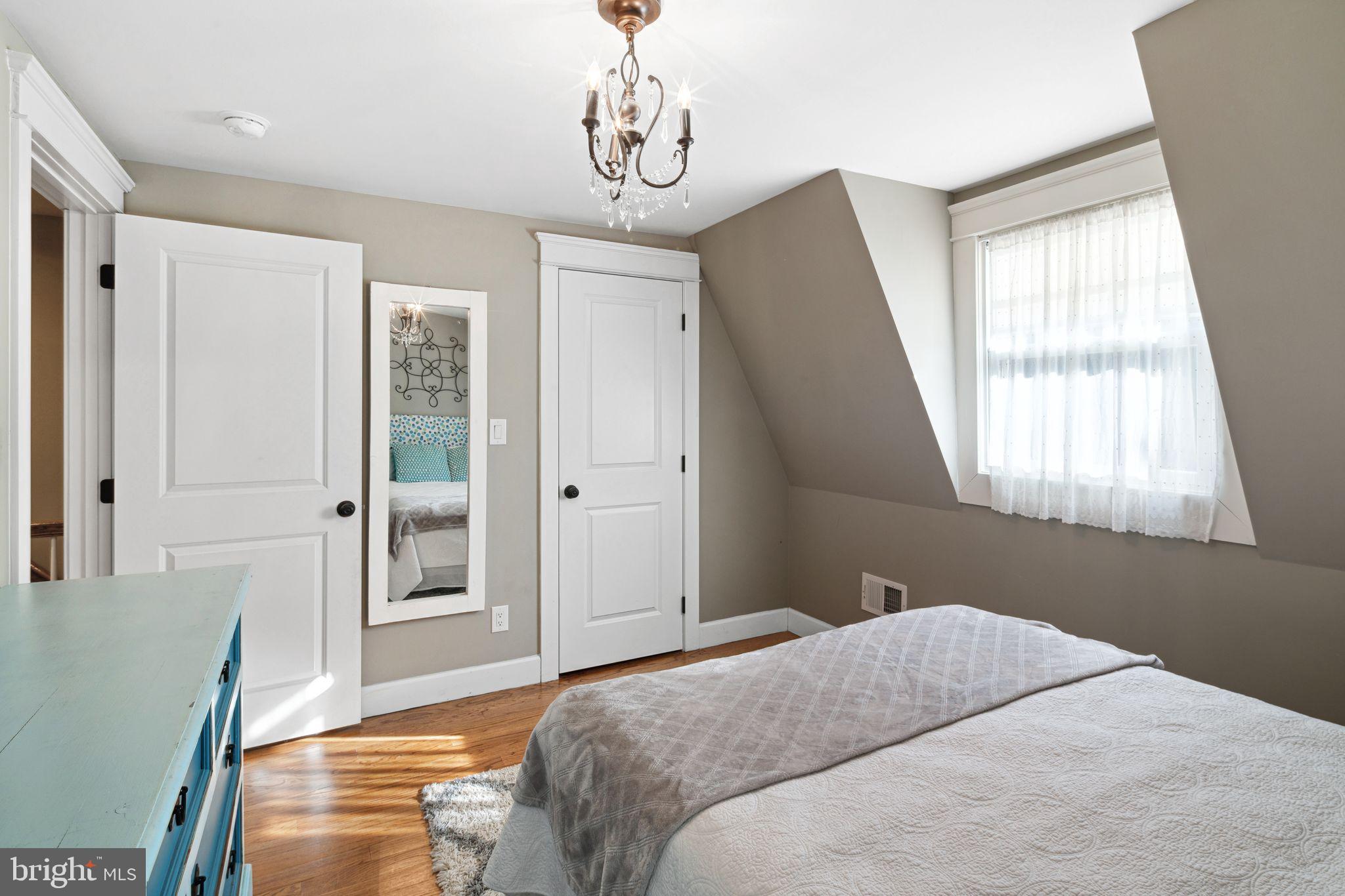 439 Crescent Road Wyncote, PA 19095 - Photo 27 of 31 a bedroom with a bed and wooden floor