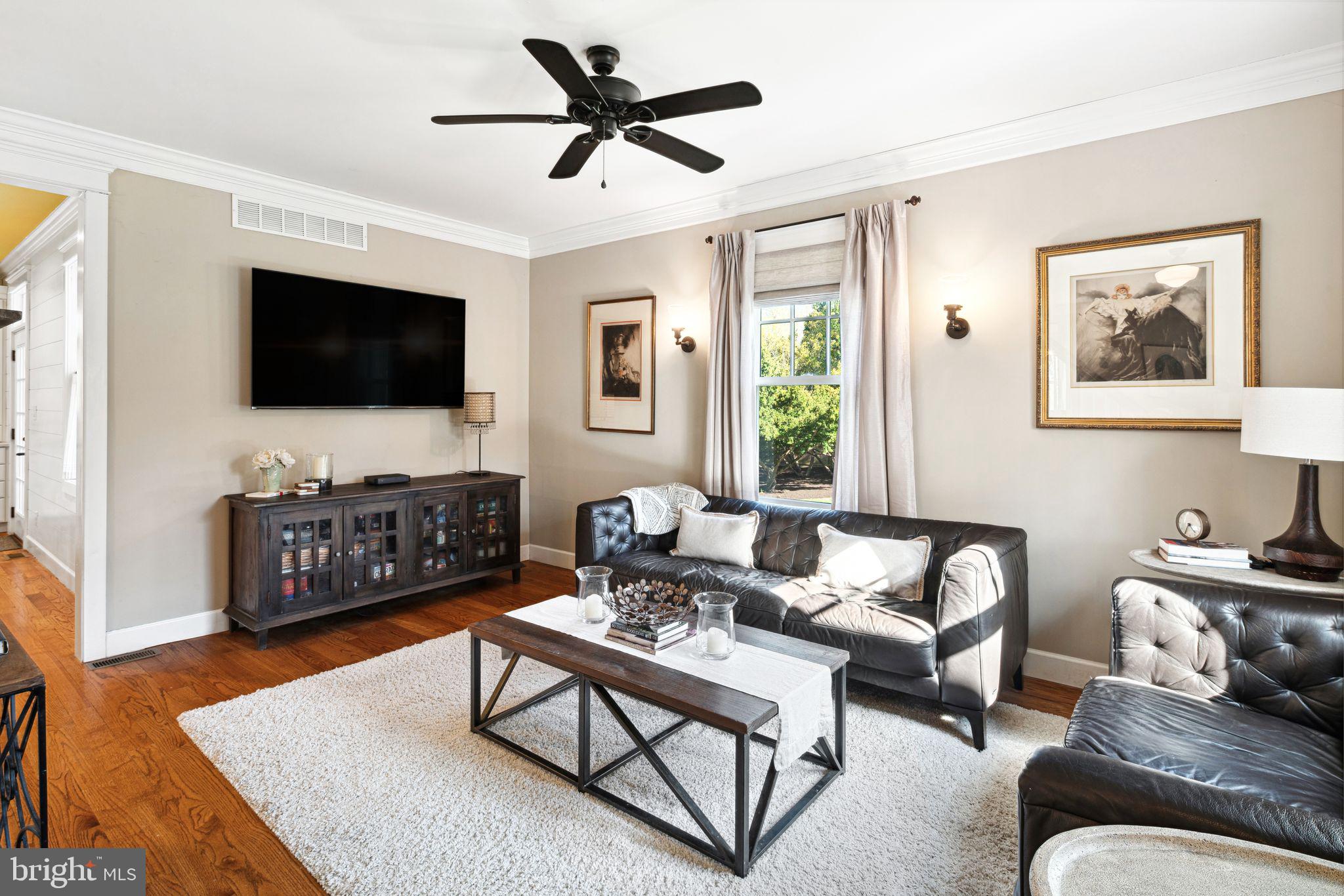 439 Crescent Road Wyncote, PA 19095 - Photo 5 of 31 a living room with furniture and a flat screen tv