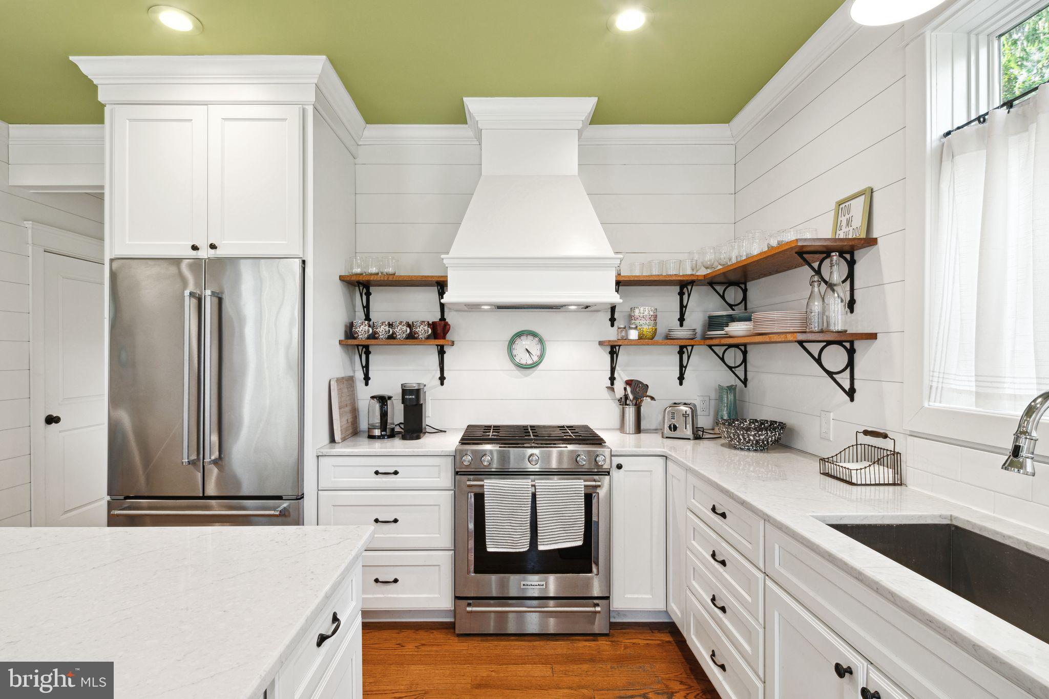 439 Crescent Road Wyncote, PA 19095 - Photo 9 of 31 a kitchen with stainless steel appliances a stove a sink and cabinets