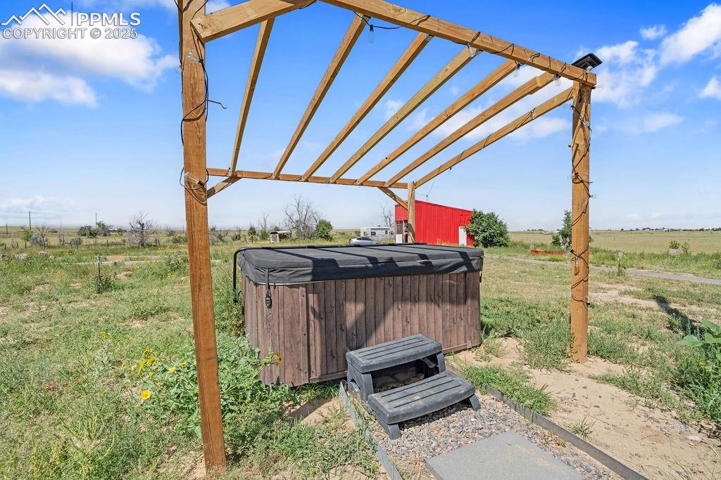 8450 Edison Road Yoder, CO 80864 - Photo 46 of 50 a view of a deck with a table and chairs under an umbrella