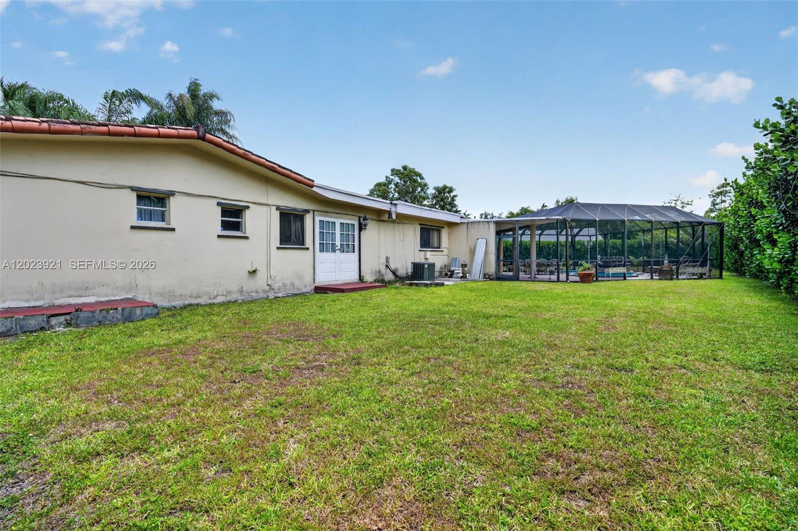 8461 Southwest 68th St Road Miami, FL 33143 - Photo 18 of 65 a front view of house with yard and green space