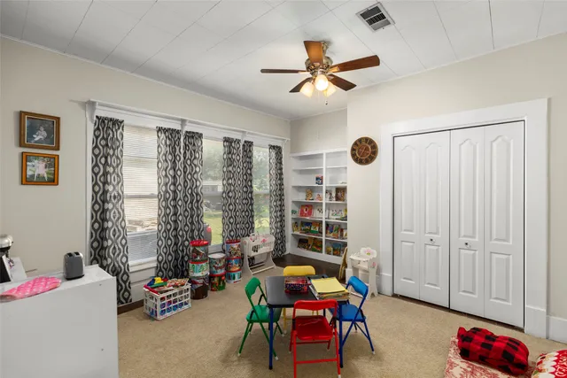 a bedroom with furniture and a window