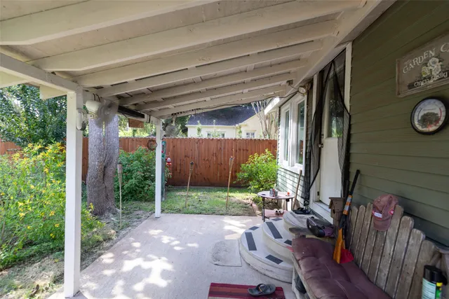 a view of yard with patio