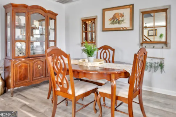 a dining room with furniture and window