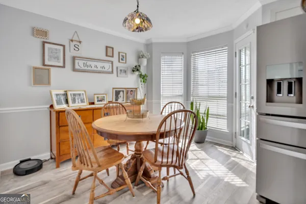 a dining room with furniture and window