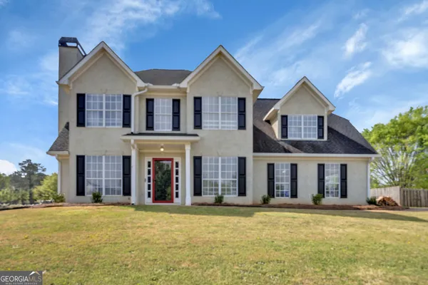 front view of a house with a yard