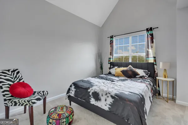 a bedroom with a bed and a closet
